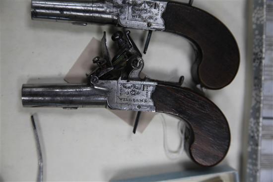 A pair of George III flintlock pocket pistols by Williams, c.1800,